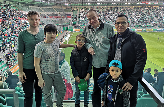 Children and adults at a football game of Rapid Wien (photo)